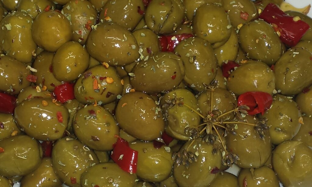 Cracked green olives dressed with red chilli, oregano and wild fennel seeds