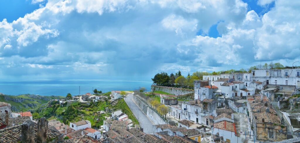 The white houses of Monte Sant'Angelo and green slopes running down to the sea, the end point of the Via Micaelica